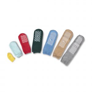 Six pairs of KSE Fall-Risk Slipper Socks in assorted colors and sizes are arranged from smallest to largest on a white background. These non-slip socks have grippy soles for added baby safety.