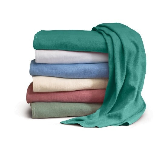 A neatly stacked pile of five Intralin Herringbone Spreads 100% Cotton towels in green, blue, cream, red, and light gray—one green towel draped over the top—all industrial laundry safe for lasting softness.