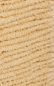 Close-up of a beige, textured cotton towel with soft, looped fibers in parallel rows, similar to the KSE Wash Cloths - 10 Single Color Towels, high-quality options often found in bulk.