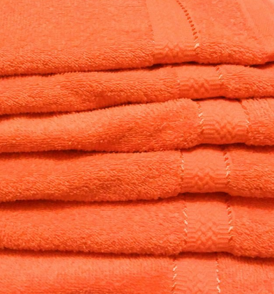 A close-up of KSE Bath Towels – 10 Single Color Towels, crafted from 100% cotton with soft, textured fabric and stitched edges—ideal for bulk wholesale needs.