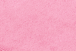 Close-up of KSE's Microfiber Cleaning Cloth in textured pink, featuring a subtle herringbone weave pattern for a high-quality finish.