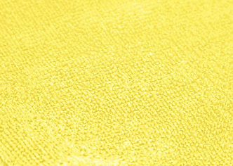 Close-up of a KSE Microfiber Cleaning Cloth in yellow, highlighting its textured surface and woven fibers for a soft, effective clean—ideal for wholesale cleaning needs.
