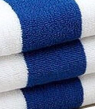Three Center Stripe Hand & Bath Towels by Intralin, featuring blue and white patterns, are stacked neatly. Made from 100% cotton for superior softness.