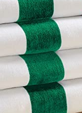 A stack of Intralin Center Stripe Hand & Bath Towels - 10s Towels, made from soft 100% cotton with a wide green stripe, are neatly folded to showcase their crisp quality and standout design.
