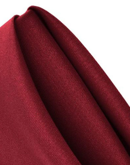 A close-up of neatly folded Ganesh Mills Oxford Spun Poly Satin Band Napkins in burgundy, featuring a smooth texture and subtle sheen.