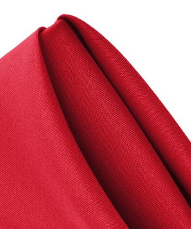 A close-up of a Ganesh Mills Napkins - 100% Spun Economy Cloth, neatly folded to display its smooth texture and crisp creases, set against a white background.