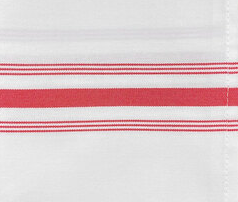 A close-up of Ganesh Mills Bistro Napkins—White w/ Color Stripes—showing three horizontal red stripes (two thin, one thick) and a visible seam on the right.
