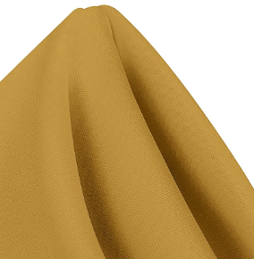 A close-up of Ganesh Mills' MagicSpun mustard yellow polyester napkin draped in a triangle, highlighting its smooth texture and soft folds—ideal for those seeking quality wholesale napkins.