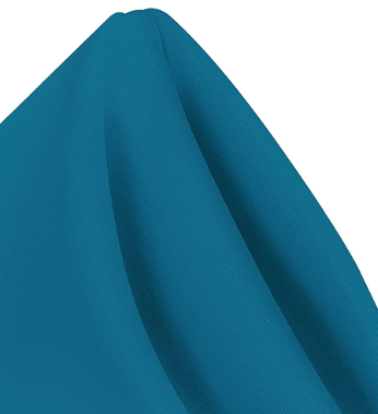 A close-up of a teal Ganesh Mills MagicSpun polyester napkin, neatly folded with visible texture—ideal for anyone seeking quality wholesale napkins.