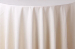 The Oxford Round Table Linen by Ganesh Mills features multicolor, smooth polyester fabric that drapes gracefully with soft vertical folds—ideal for anyone seeking elegant table linens for round tables.