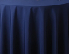 The Ganesh Mills Oxford Round Table Linen - Multicolor features a floor-length polyester design that drapes smoothly over round tables with elegant, soft folds.