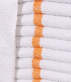 A stack of Intralin Wholesale Bar Mop Towels, featuring a white terry design with an orange stripe down the center, is neatly arranged in a vertical pile.