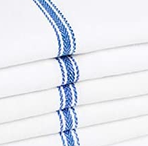 A stack of Intralin Kitchen Towel - Herringbone Kitchen Towels, neatly folded with a decorative blue embroidered stripe along the edge.