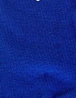 Close-up of blue ribbed fabric, highlighting the texture and vertical lines of KSE Double-Tread Slipper Socks, commonly used as non-slip hospital socks.