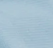 Close-up of the Calderon Textiles Microfiber Tricot Glass Cloth, featuring a light blue textured surface with subtle horizontal lines and gentle shading, designed for softness, durability, and cost-effective cleaning.