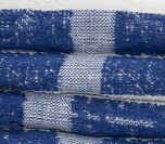 Close-up of the Calderon Textiles International Pool Towel, made from 100% cotton with blue and white stripes—a textured, absorbent choice for hand or bath use in any bathroom.
