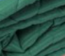 A close-up view of several layers of green fabric with visible creases and texture, resembling KSE Microfiber String Dust Mop Pads - Pocket Style.