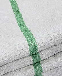 Close-up of KSE Bar Mops—white terry cloth towels with a textured surface and a single green center stripe.