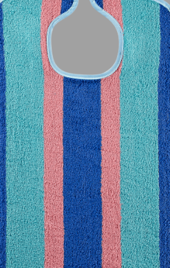 A close-up of the KSE Premium Adult Terry Bib / Clothing Protector shows vertical aqua, pink, and dark blue stripes with a rounded neck cutout and velcro closure—combining style with practical protection.