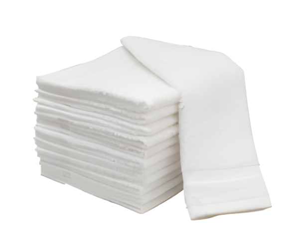 A stack of Manhattan Hosiery Co. 10S Cotton Towels in multiple sizes and weights, with one rectangular white pad slightly pulled out, displayed on a plain white background.