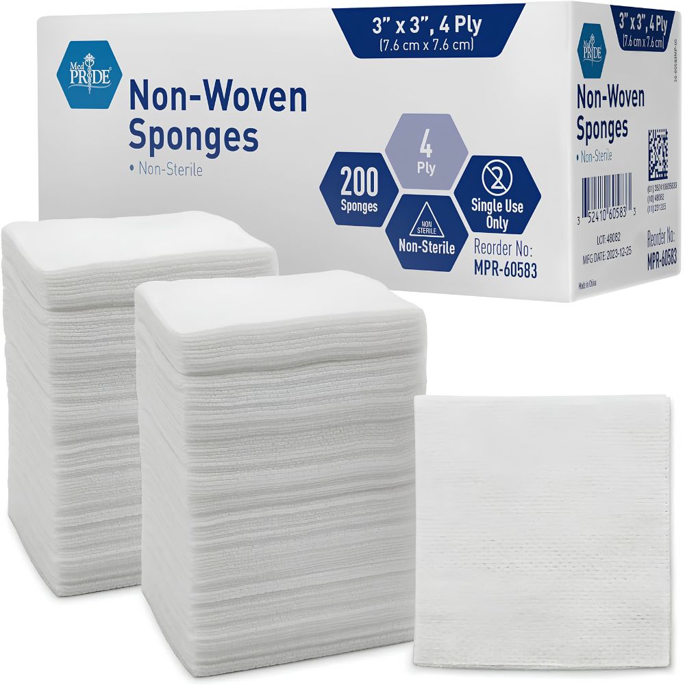 A Shield Line MedPride Non-Woven Surgical Sponges box (3"x3", 4-ply, 200 non-sterile sponges for single-use wound care) sits behind two tall stacks and one square of white medical dressings.