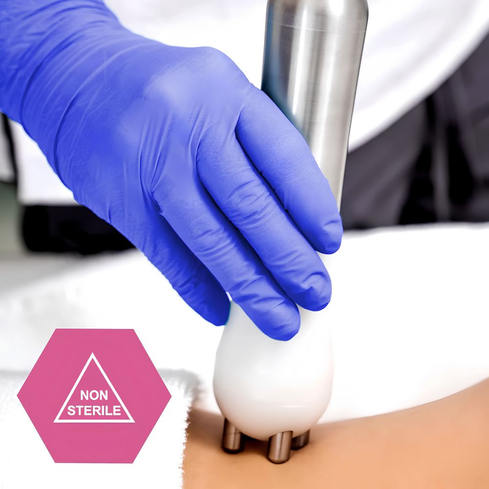 A person wearing Shield Line MedPride Nitrile Exam Gloves (4 Mil, Non-Latex, Powder Free, Non-Sterile) uses a handheld device with metal rollers on someone’s skin. A pink hexagon labeled NON STERILE appears in the corner.