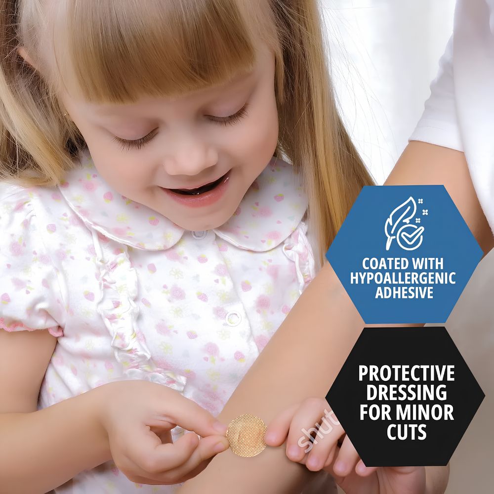 A young girl smiles while applying a Shield Line MedPride Sheer Junior Spot Adhesive Bandage (3/8” x 1.5”) with hypoallergenic adhesive and a non-stick pad, perfect for protecting minor cuts.
