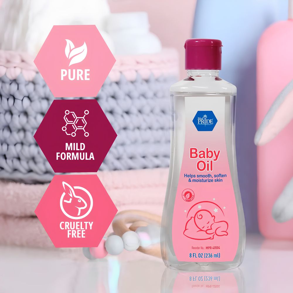 A pink-capped 8 oz MedPride Baby Oil by Shield Line, labeled as pure, mild, and cruelty free with a seal & flip top, sits on a white surface. Soft pastel towels and toys blur in the background—ideal for gentle skin moisturizing.