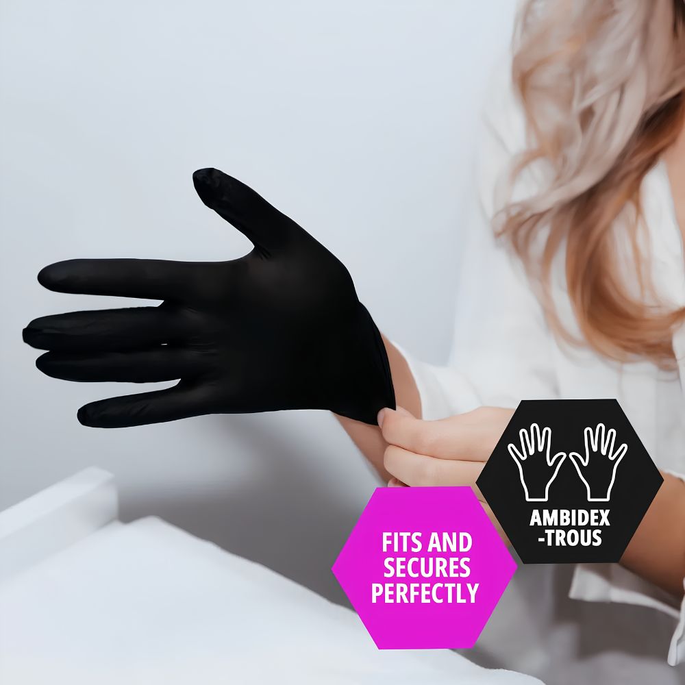 A person in a white shirt puts on Shield Line MedPride Black Nitrile Exam Gloves (Powder Free, Non Sterile, 4 Mil Thick). Pink and black hexagon graphics say "Fits and secures perfectly" and "Ambidextrous." Only hands and part of torso are visible.