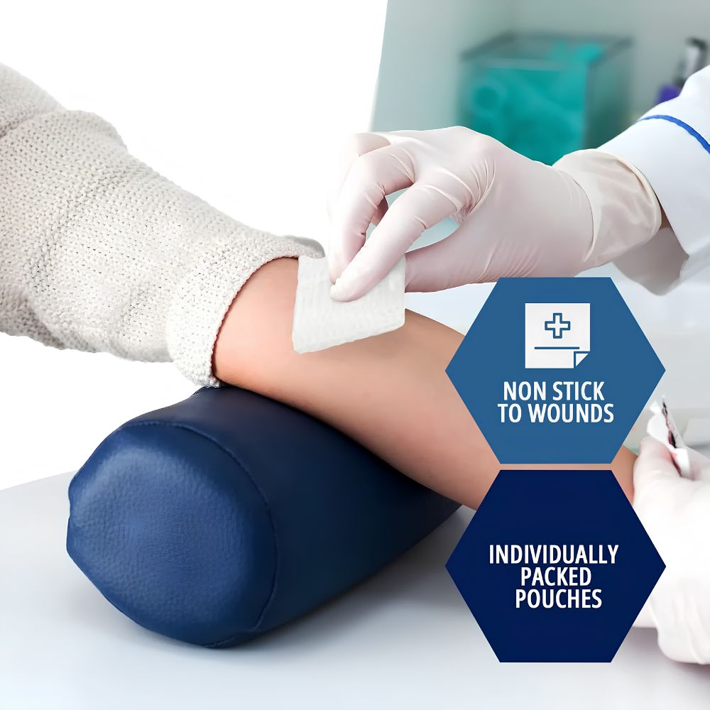 A gloved hand places a Shield Line MedPride Sterile Gauze Pad on an arm resting on a blue cushion. Text reads: “NON STICK TO WOUNDS” and “INDIVIDUALLY PACKED POUCHES”—ideal for first aid kits (2"x2", 3"x3", 4x4, 12 ply).