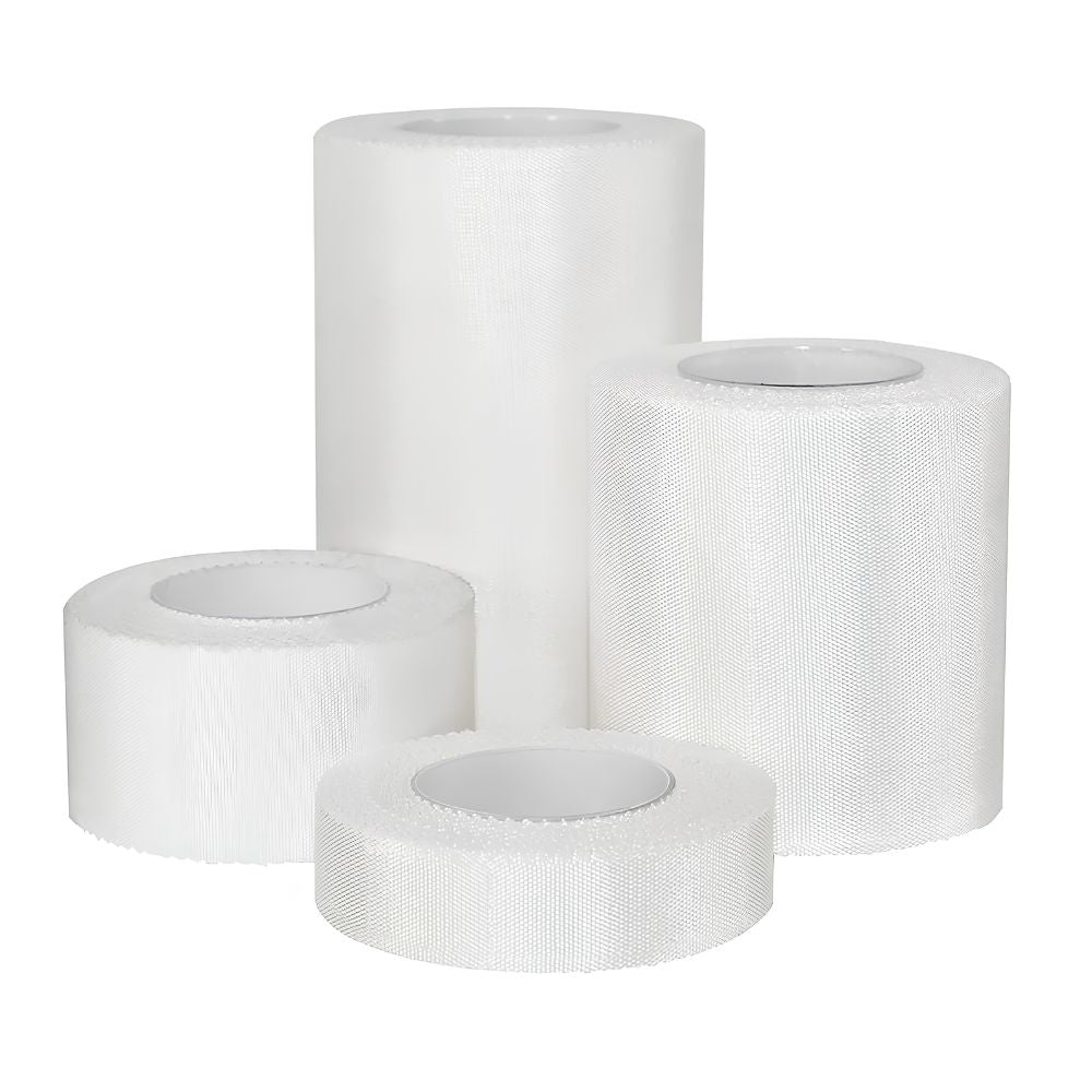 Four rolls of Shield Line MedPride Cloth Surgical Tape (1/2", 1", 2", 3" x 10 yds) are arranged upright and lying down against a white background, ideal for wound care or as cloth surgical tape.