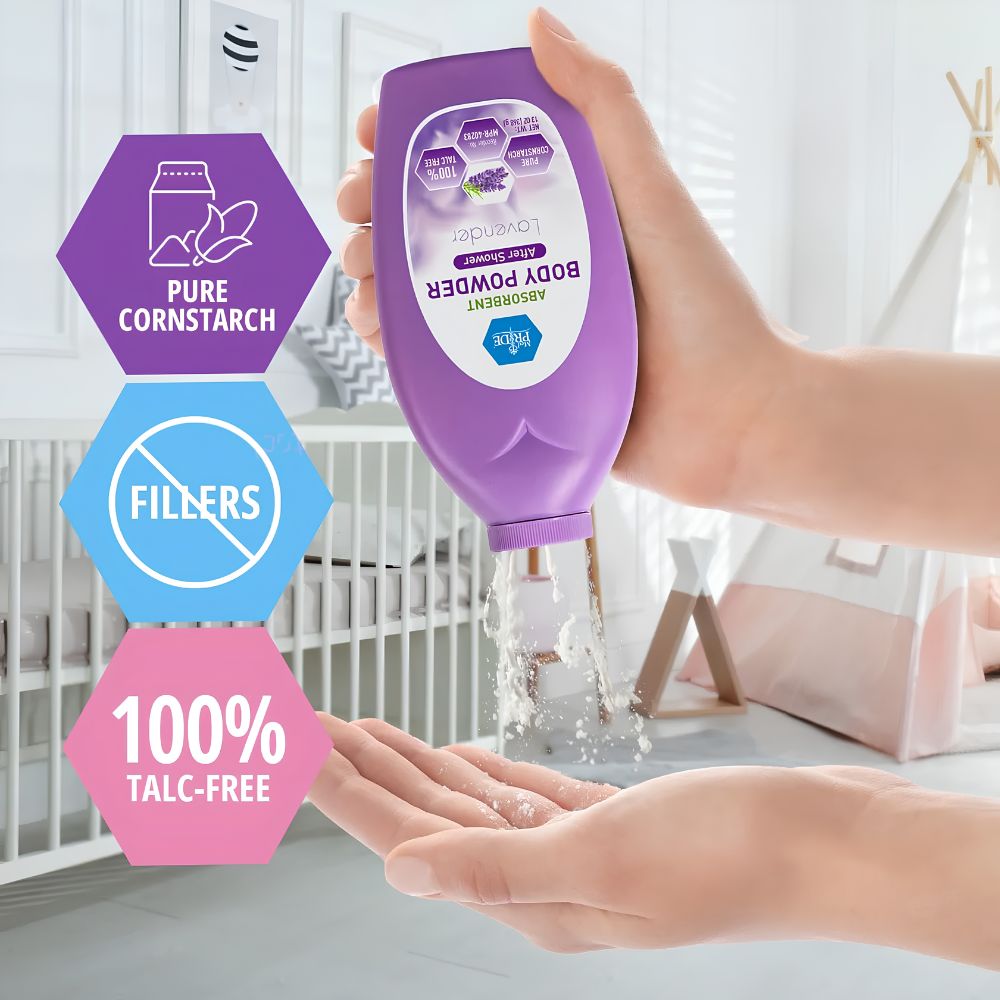 A hand pours MedPride Body Powder w/seal - 13 oz by Shield Line from a purple bottle onto another hand. The lavender-scented, talc-free cornstarch formula gently protects delicate skin, with a crib and nursery items visible in the background.