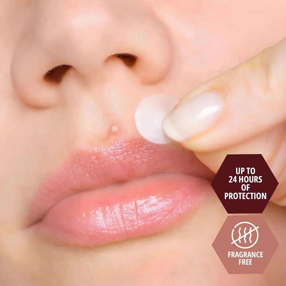 A close-up of a person applying a Shield Line Medpride Hydrocolloid Acne Patch (12mm) to a pimple above their lip. Two icons show up to 24 hours of protection and that the patches are alcohol-free.