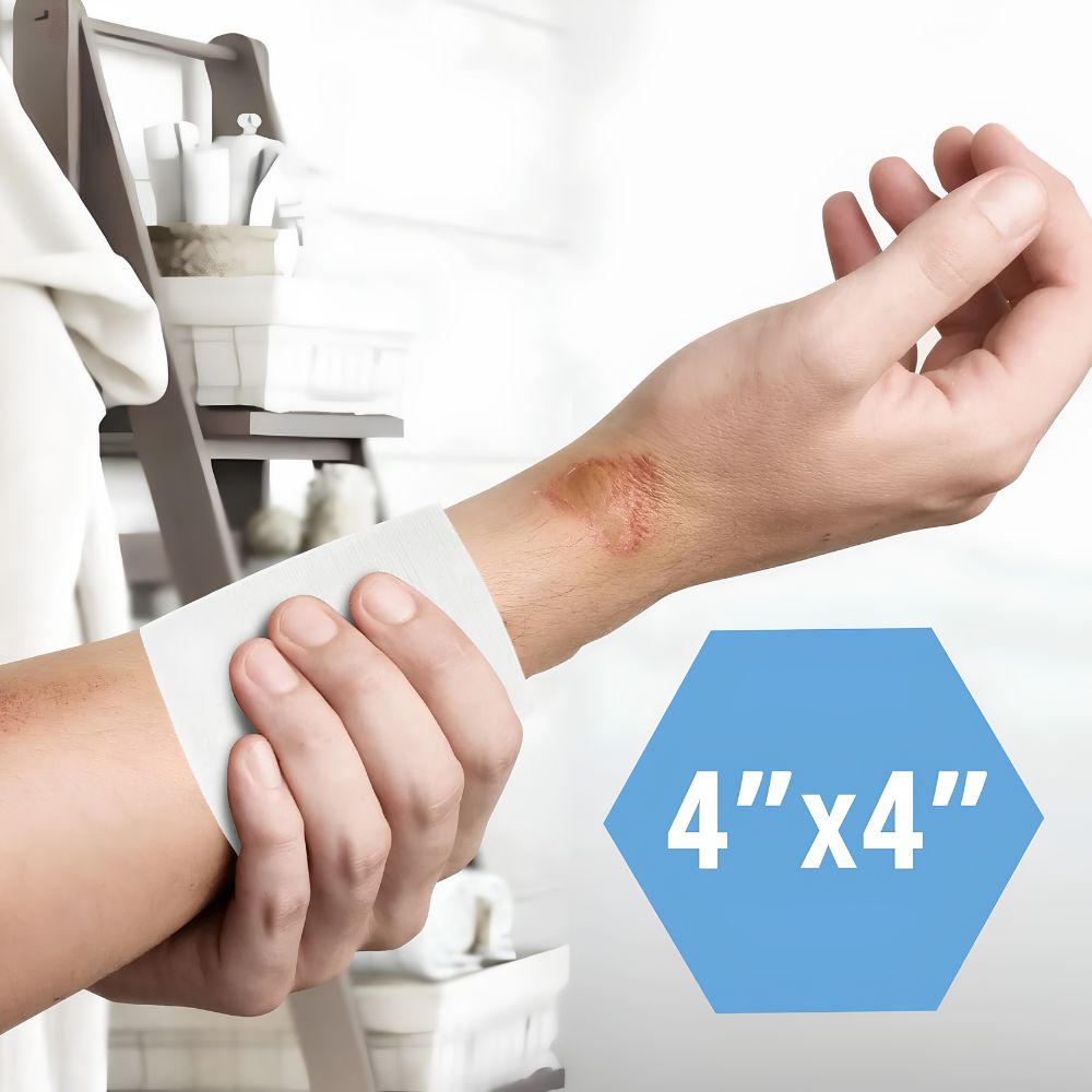 A person applies a Shield Line MedPride Non-Woven Surgical Sponge (4"x4", 4-ply) to a healing wrist wound. A blue hexagon shows “4 x 4” in white text, with toiletries blurred in the background.