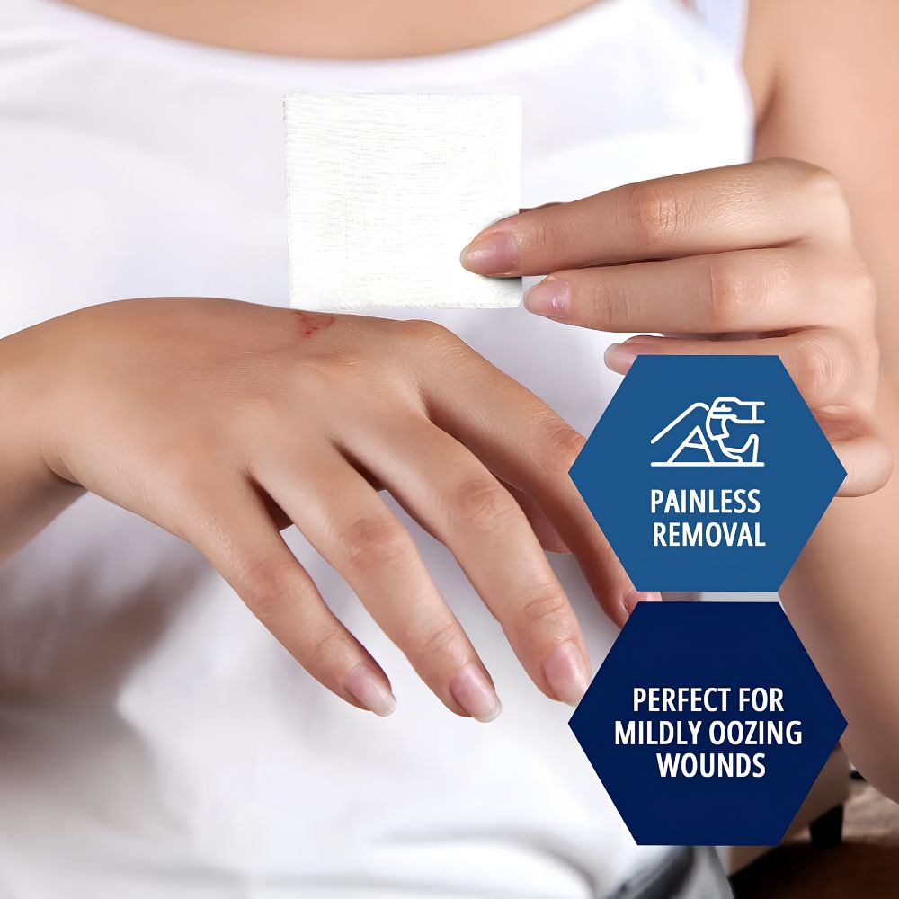 A person holds a Shield Line MedPride Sterile Gauze Pad near a small hand wound. Text: Painless removal, perfect for mildly oozing wounds, ideal for first aid and gentle dressing. Available in 2"x2", 3"x3", and 4"x4" sizes, 12-ply.