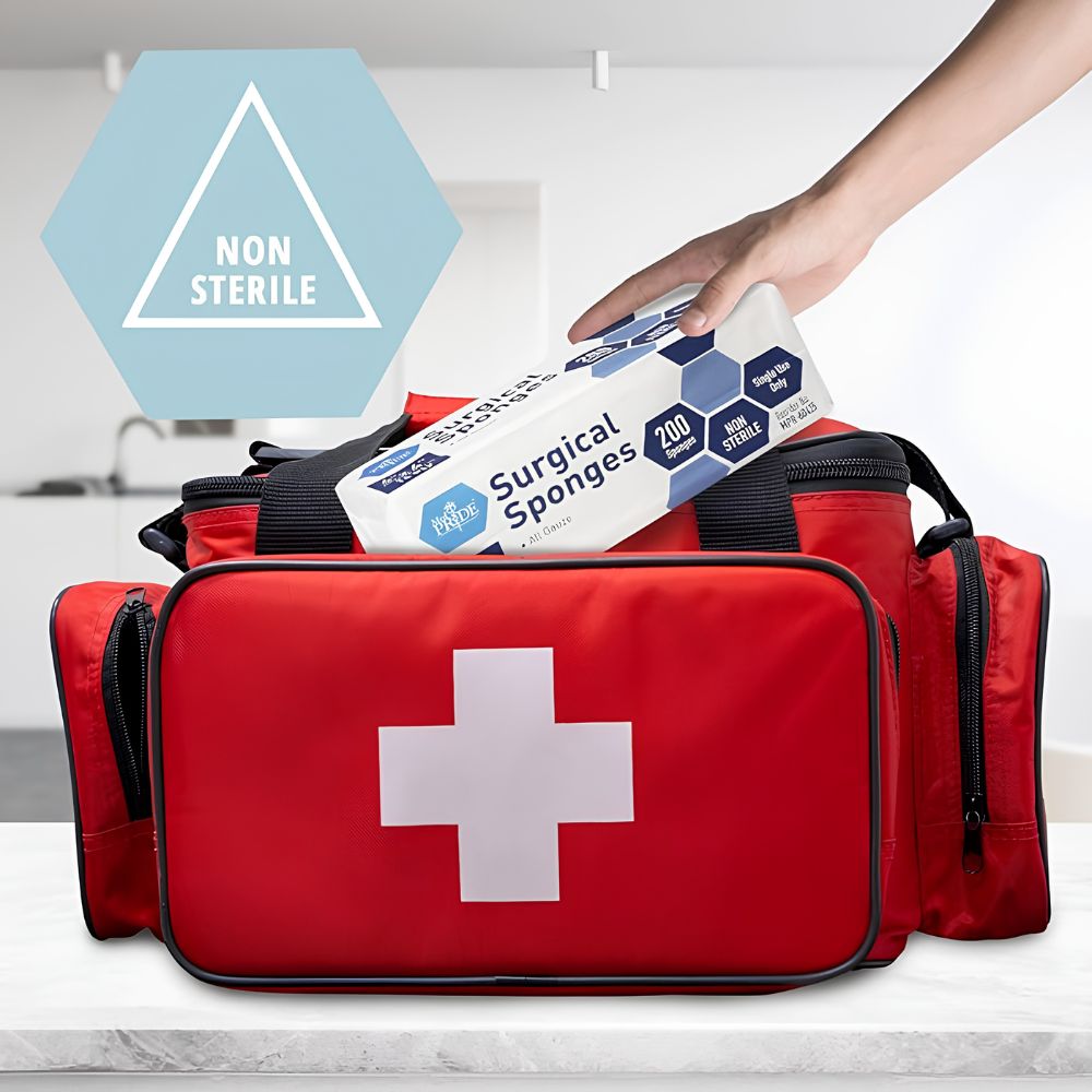 A hand places a box labeled "Shield Line Medpride All Gauze Surgical Sponge Non-Sterile, 4”x4”, 12-ply & 16-ply" into a red first aid kit with a white cross. A hexagonal sign in the background highlights its non-sterile wound care use.