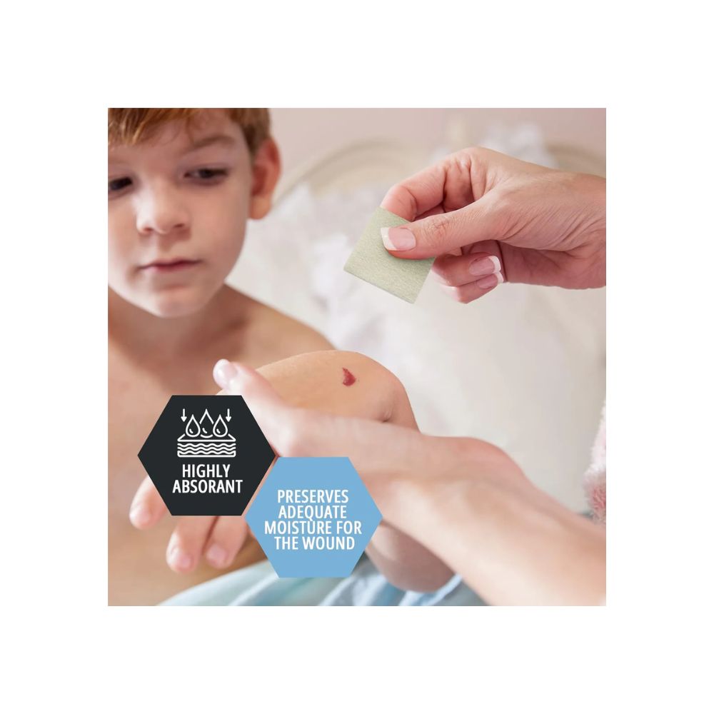 A child looks at a scraped knee as an adult applies a Shield Line MedPride Calcium Alginate Dressing. Text reads: "Highly Absorbent advanced wound healing. Preserves adequate moisture for the wound," with related icons.