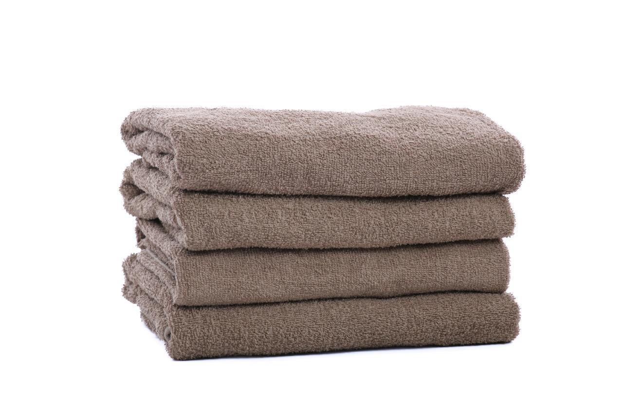 A stack of four KSE Bath Towel - Solid Brown Towels, crafted from soft cotton and set against a white background—perfect for anyone seeking high-quality bulk towels.