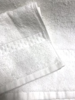 Close-up of two folded Towels 3 Row Checkered by 1Concier, stacked to highlight their check weave texture and neatly finished hems.