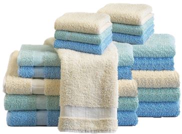 A set of KSE Bath Towels - Solid Color Towels in blue and cream, neatly stacked in three piles of various sizes, with a cream towel draped over the front center stack.