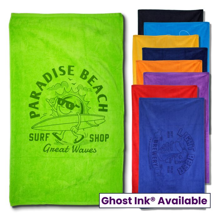 The Pro Towels Colored Beach Towel - Diamond Collection in green features a cartoon sun surfing with "Paradise Beach Surf Shop Great Waves." Seven other towels are stacked to the right. Ghost Ink® Available and custom embroidery options shown below.