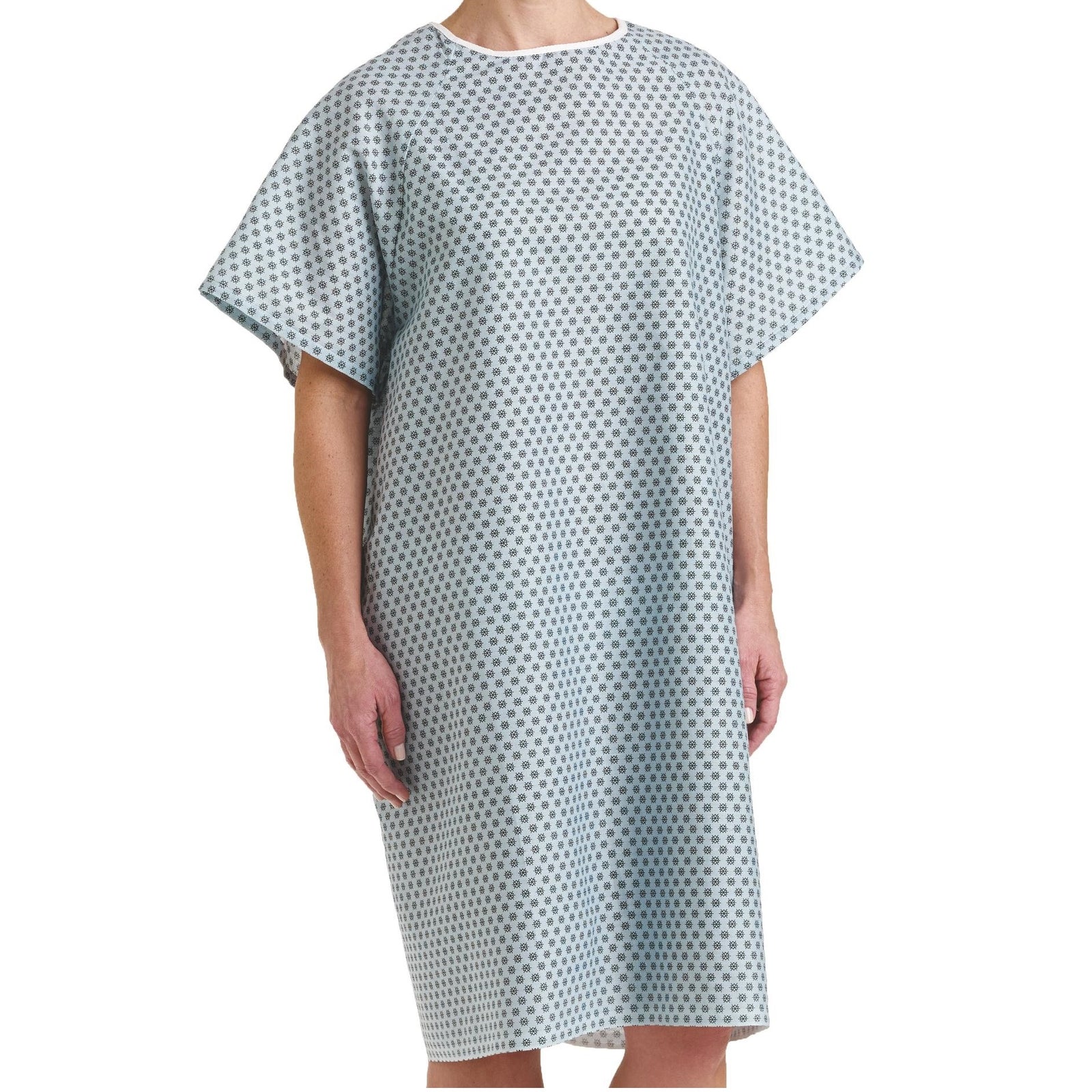 A person models the KSE Traditional Patient Gown, featuring a loose fit, short sleeves, and a subtle blue and white geometric pattern. The individual stands against a plain white background with their face not shown.