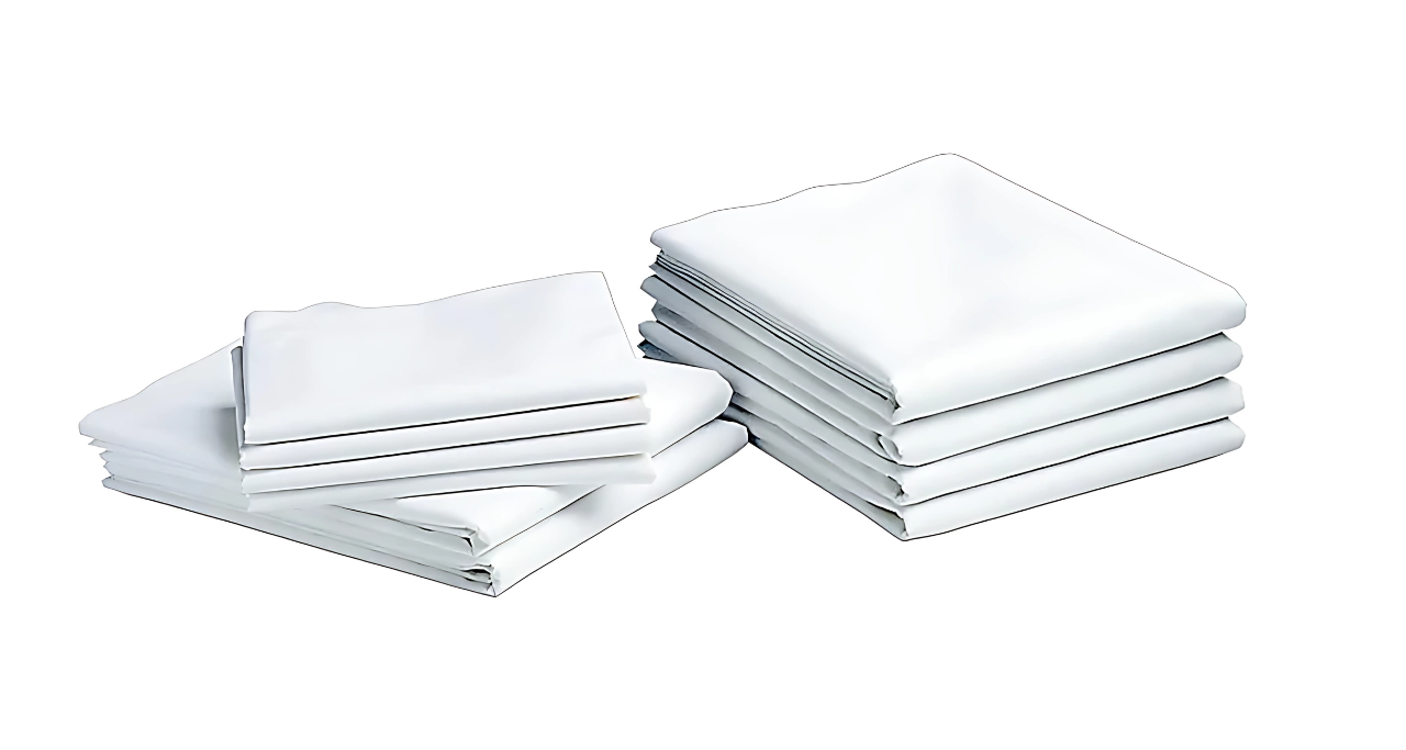 Two stacks of KSE Flat Sheets - Economy T130 (Twin/Full) are neatly folded on a white background, ideal for those needing budget-friendly bulk bedding.