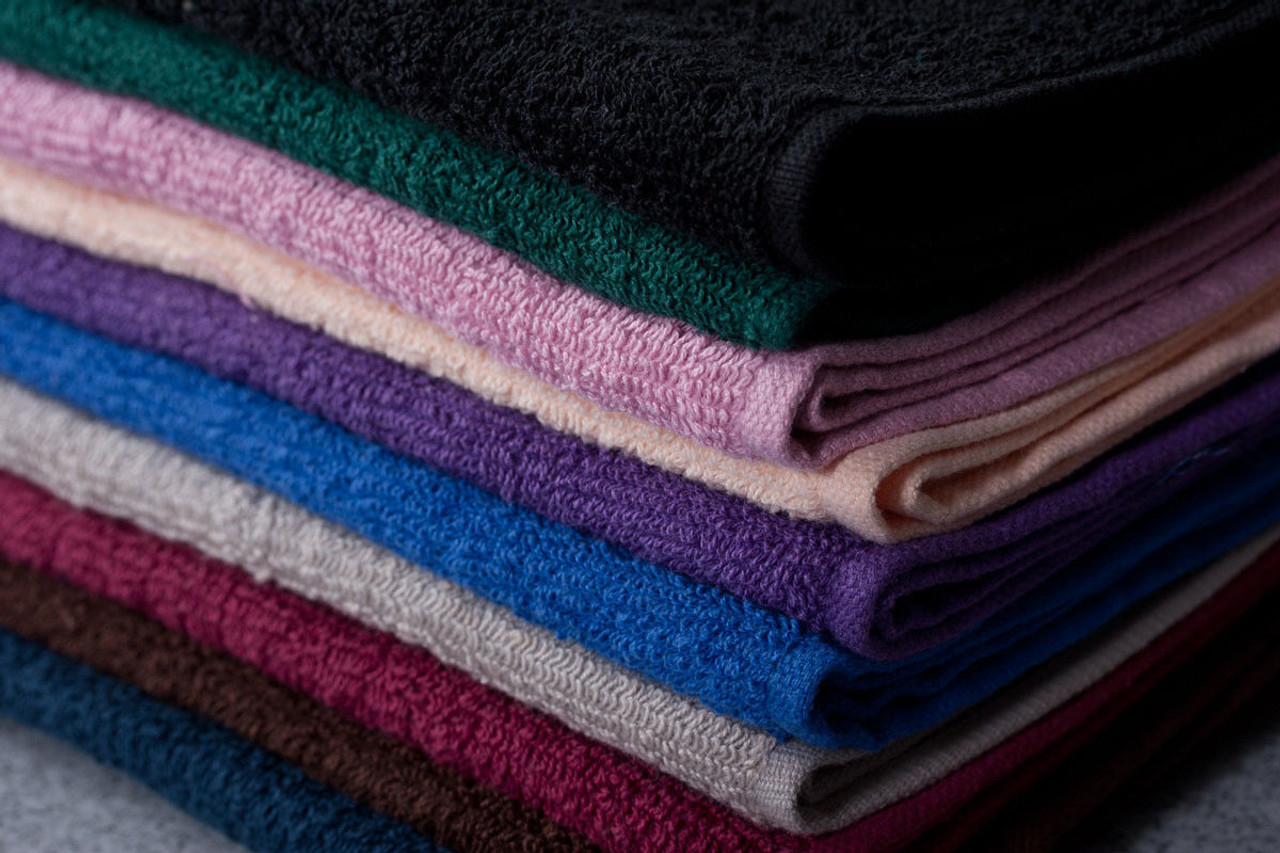 The Oxford Salon And Spa Towel - Colored by Ganesh Mills is a ringspun cotton towel available in black, green, pink, purple, beige, blue, burgundy, and brown—ideal for salon or spa use.