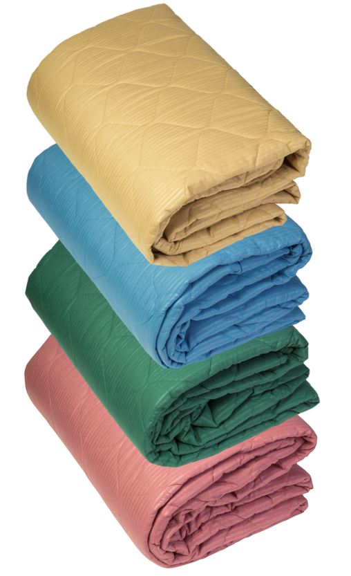 Four KSE Quilted Bedspreads, featuring a soft onion stitch pattern, are folded and stacked in beige, blue, green, and pink—ideal for adding comfort to your wholesale bedding collection.