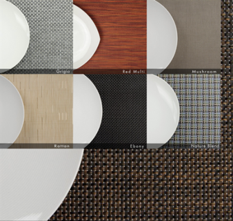 Six white plates are arranged on 1Concier Place Mat Wide Bskt Woven Vinyl placemats in Grigio, Red Multi, Mushroom, Rattan, Ebony, and Nature Blend—ideal for a stylish tabletop.