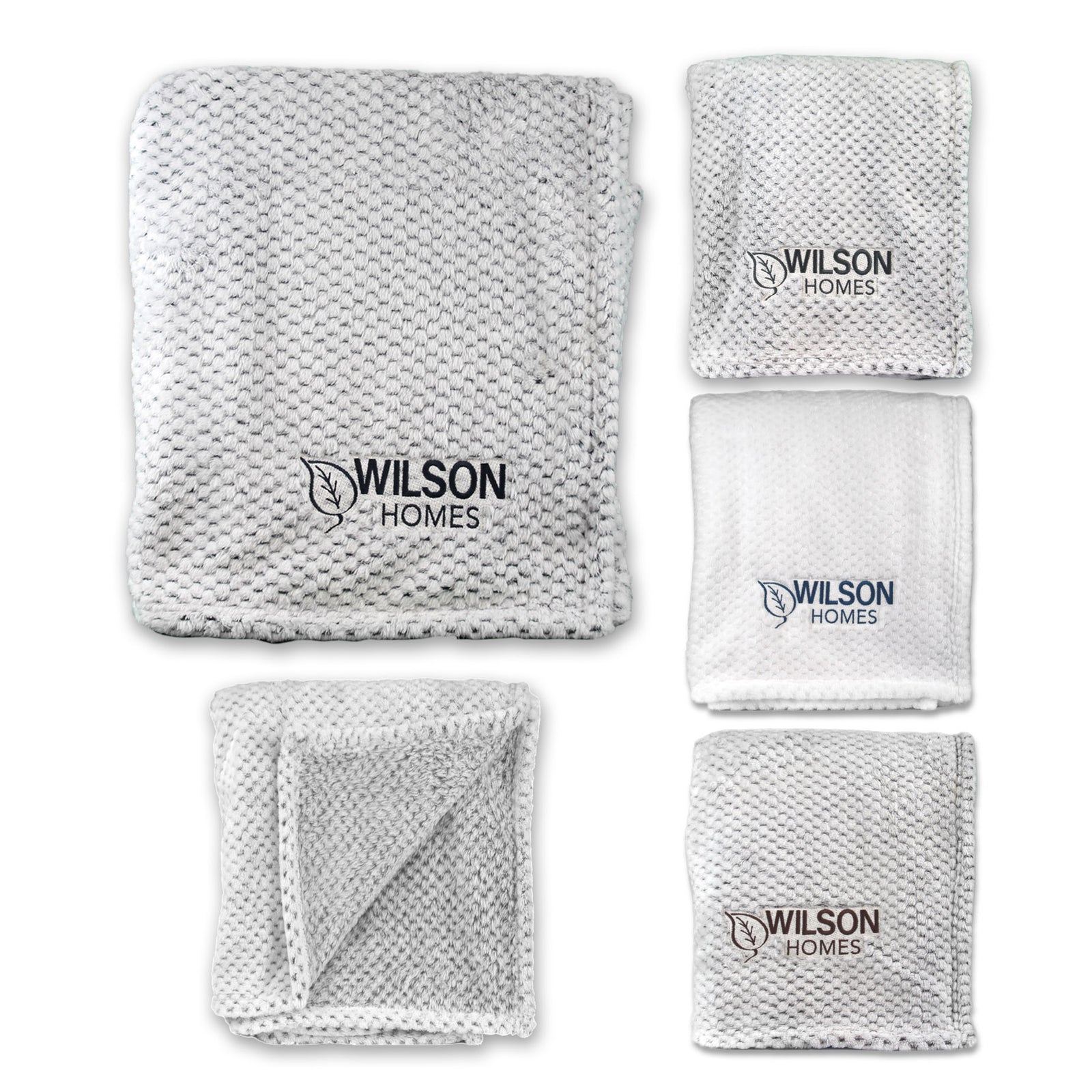 Five views of a white Wanderlust Blanket by Pro Towels, featuring plush textured fabric and custom embroidery. Shown folded and unfolded, its perfect for everyday use or as a bulk wholesale travel blanket option.