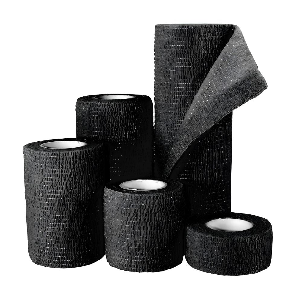 Five Shield Line Medpride Self-Adherent Wrap rolls (black, sizes 1", 2", 3", 4", and 6" x 5 yds) are arranged together on a white background, with one roll partly unwrapped to show its texture.