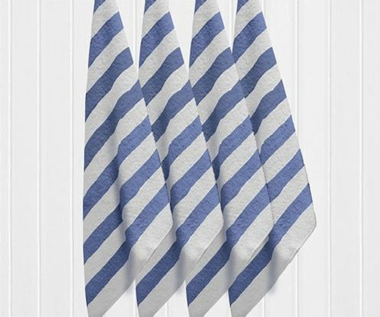 Four 1Concier Pool Towe Plunge pool towels hang side by side against a white paneled wall. The blue and white diagonal stripes are neatly arranged and evenly spaced, highlighting the stylish design of these cotton towels.