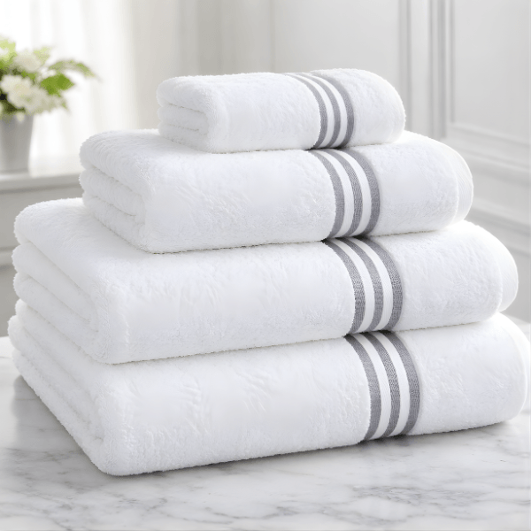 Soft white hospital towels stacked neatly for medical, clinic and healthcare facility use